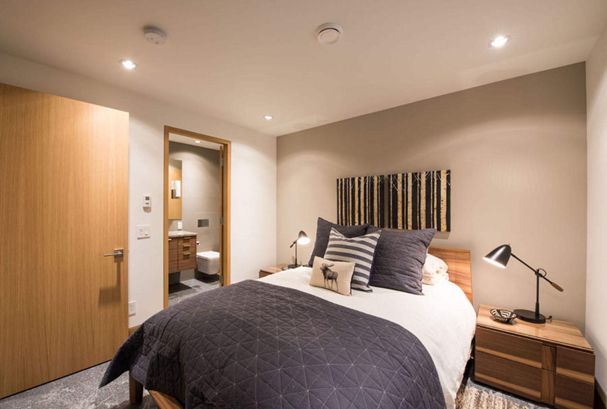 bright queen bedroom with ensuite bath